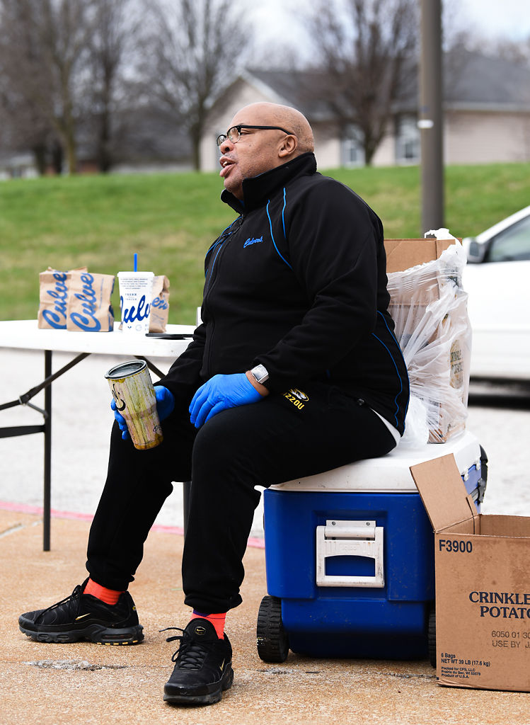Rev. James Gray sits on a cooler